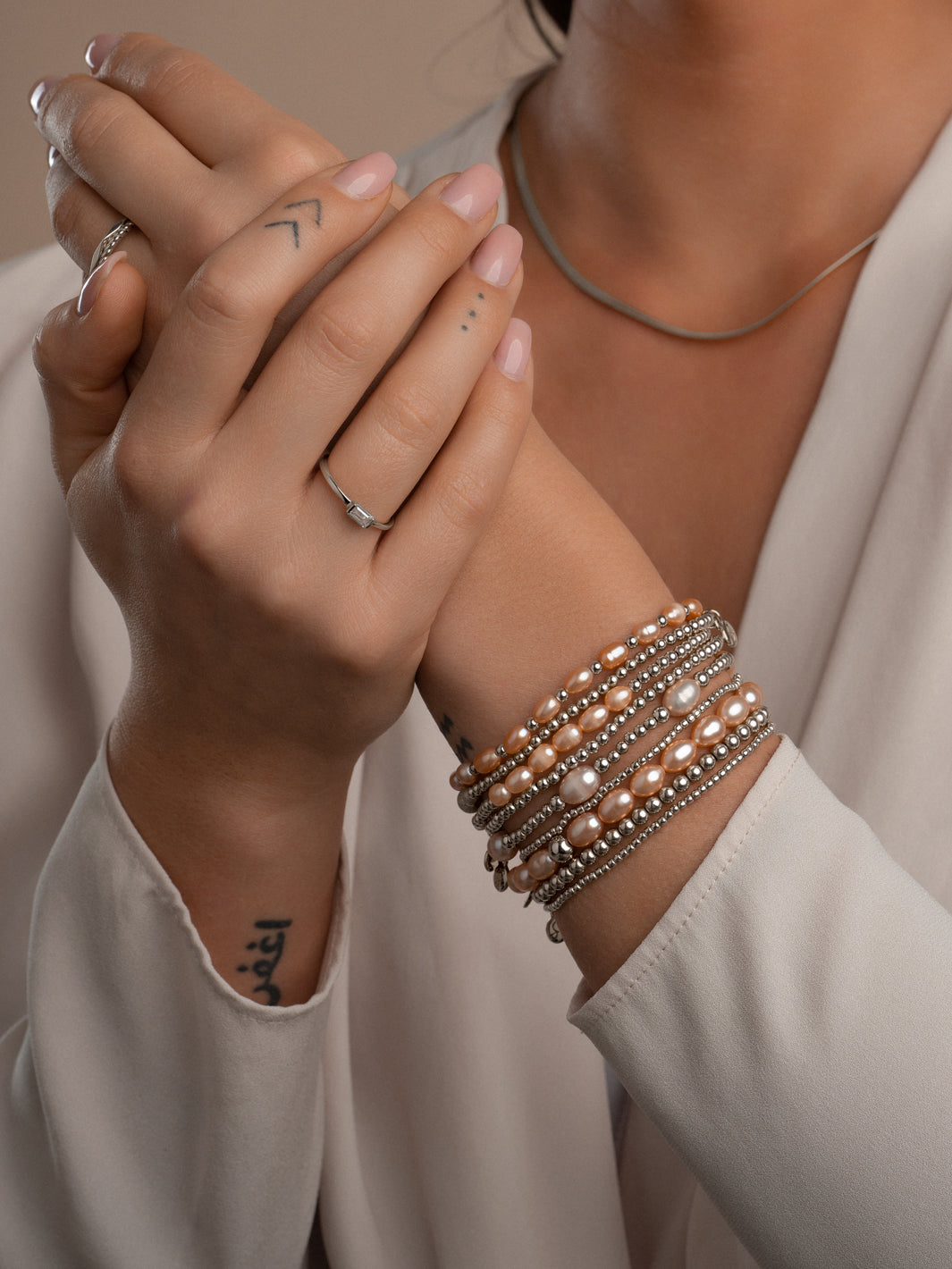 Armband die niet verkleurt met echte parels in perzik kleur