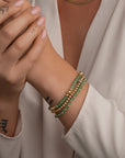 Sparkling Kralen armbanden in goudkleur met groene edelstenen 